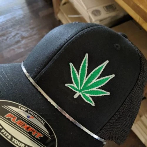 This fun #glowinthedark #weed cap is a popular seller on our etsy page. Check it out here: https://etsy.me/2LQzLu5 #420  #embroidered #customcaps